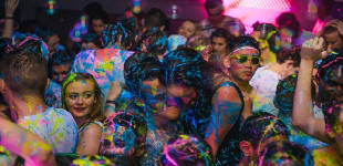 revellers at Night club UV Neon Paint Party