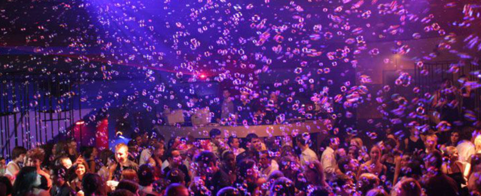 night club full of uv bubbles at a bubble party