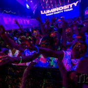 clubbers glowing at uv paint party