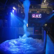 Foam generator filling nightclub dance floor with foam